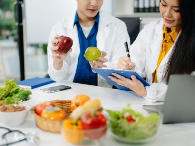 Nutritionists consulting on healthy food choices, meal planning, and wellness concepts with fresh fruits, vegetables, and diet care tips for a balanced lifestyle